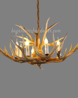 this candelabra-stylized chandelier is perfect for a mountain cabin or lake house.