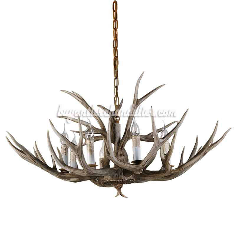 this candelabra-stylized chandelier is perfect for a mountain cabin or lake house.